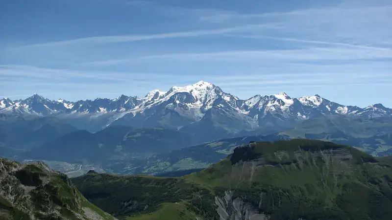 The Mont Blanc massif seen across alpine pastures